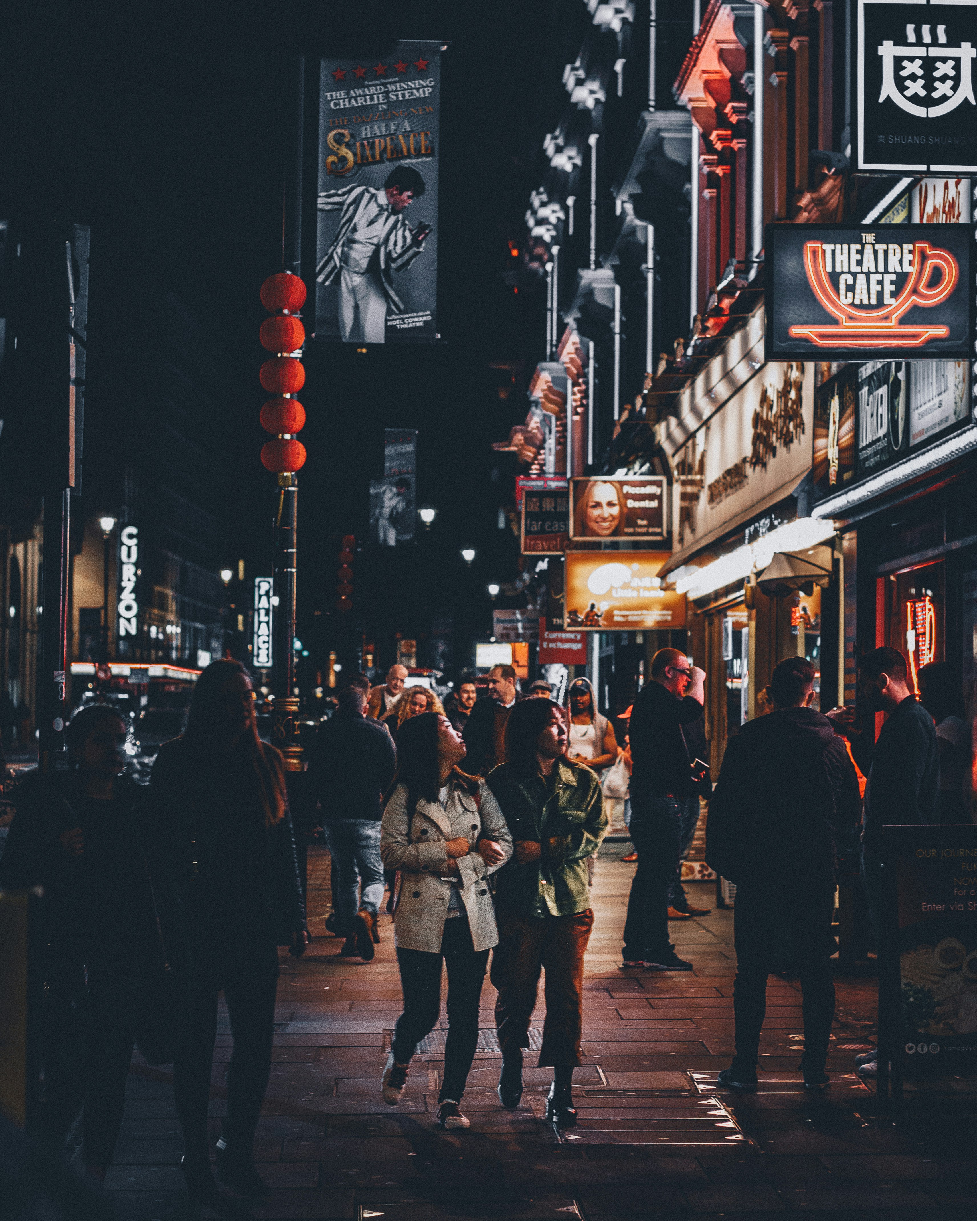 two women standing near theatre cafe